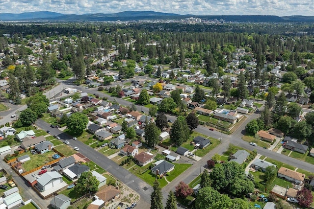 4218 N E St, Spokane, WA 99205 - aerial overview of property's location featuring a mountainous background, a forest, and nearby suburban area