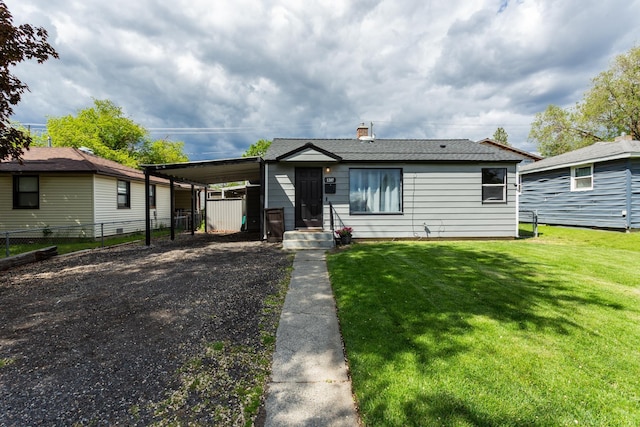 1207 E Bismark Ave, Spokane, WA 99208 - view of front facade with an attached carport, gravel driveway, and a chimney