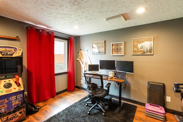 1207 E Bismark Ave, Spokane, WA 99208 - home office with a textured ceiling, wood finished floors, and baseboards