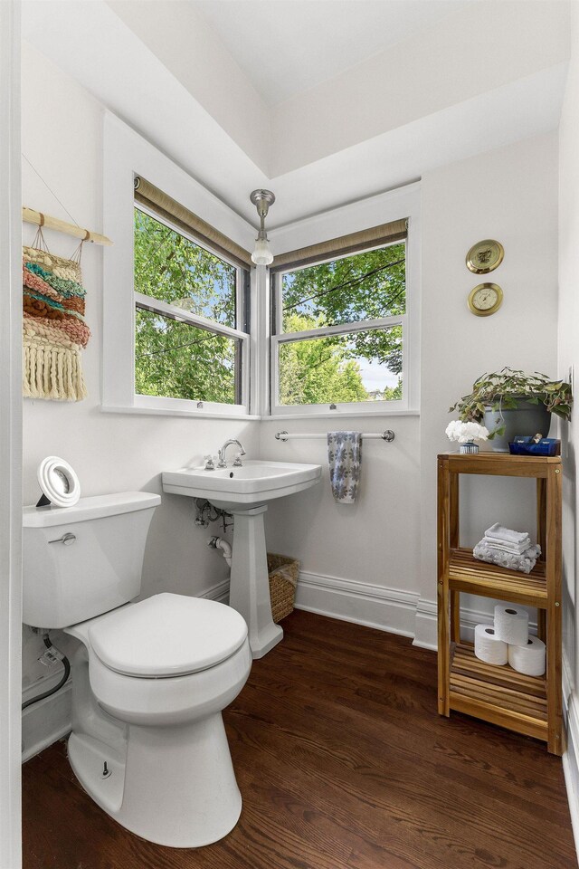 1732 W 14th Ave, Spokane, WA 99204 - bathroom with healthy amount of natural light, toilet, and wood finished floors