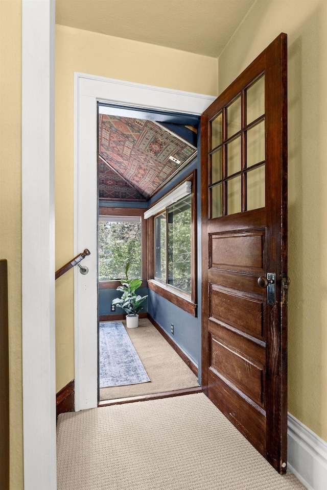 1732 W 14th Ave, Spokane, WA 99204 - doorway to outside featuring carpet and baseboards
