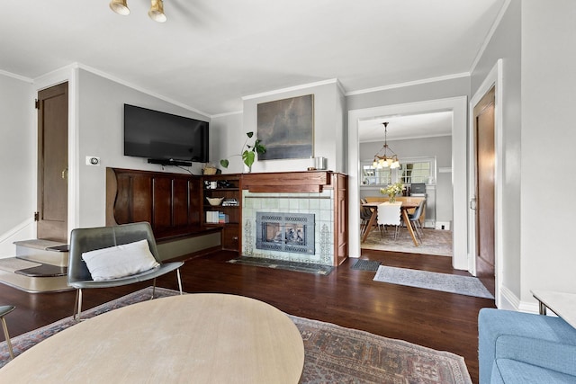 1732 W 14th Ave, Spokane, WA 99204 - living room featuring wood finished floors, ornamental molding, a fireplace, and baseboards