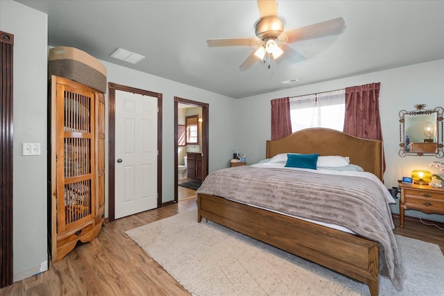 2215 N 8th St, Cheney, WA 99004 - bedroom with wood finished floors, ensuite bathroom, and ceiling fan