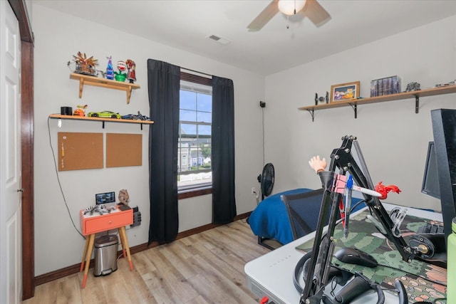 2215 N 8th St, Cheney, WA 99004 - exercise area featuring ceiling fan, light wood-type flooring, and baseboards