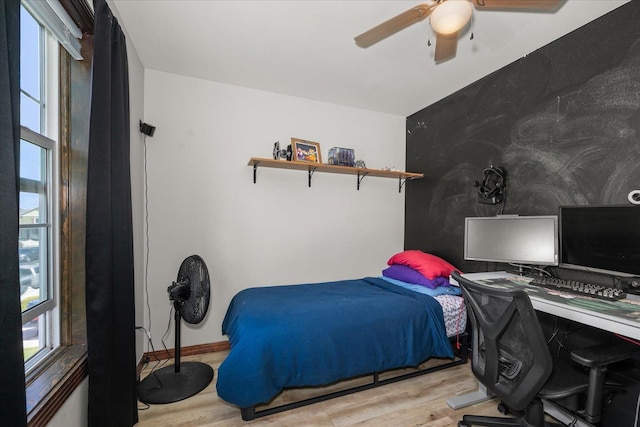 2215 N 8th St, Cheney, WA 99004 - bedroom featuring multiple windows, wood finished floors, and an office area