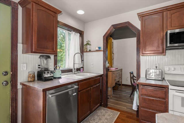 2215 N 8th St, Cheney, WA 99004 - kitchen with appliances with stainless steel finishes, a sink, dark wood finished floors, and open shelves