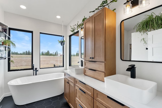 311 N Christensen Rd, Medical Lake, WA 99022 - full bathroom with tile patterned flooring, a soaking tub, double vanity, and recessed lighting
