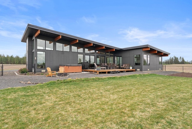 311 N Christensen Rd, Medical Lake, WA 99022 - rear view of house with a hot tub and a wooden deck