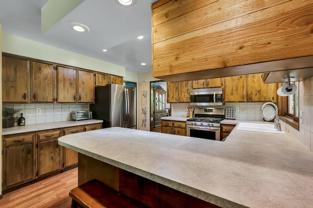 10808 47th Ave, Spokane Valley, WA 99206 - kitchen with stainless steel appliances, tasteful backsplash, light countertops, a sink, and recessed lighting