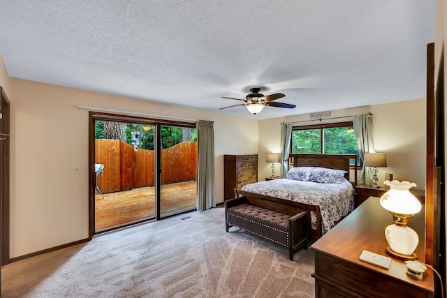 10808 47th Ave, Spokane Valley, WA 99206 - carpeted bedroom with access to exterior, a textured ceiling, a ceiling fan, and baseboards