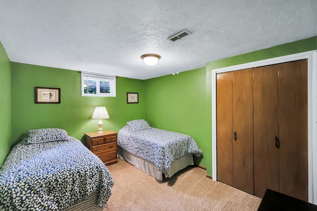 10808 47th Ave, Spokane Valley, WA 99206 - bedroom with carpet, a closet, and a textured ceiling