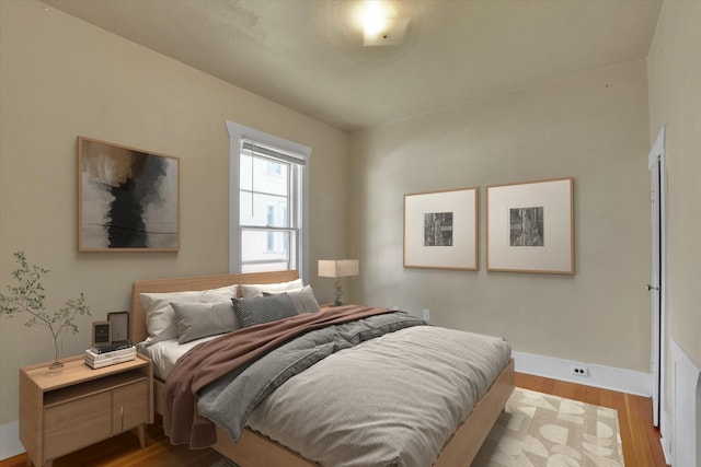 216 6th St, Cheney, WA 99004 - bedroom with baseboards and wood finished floors