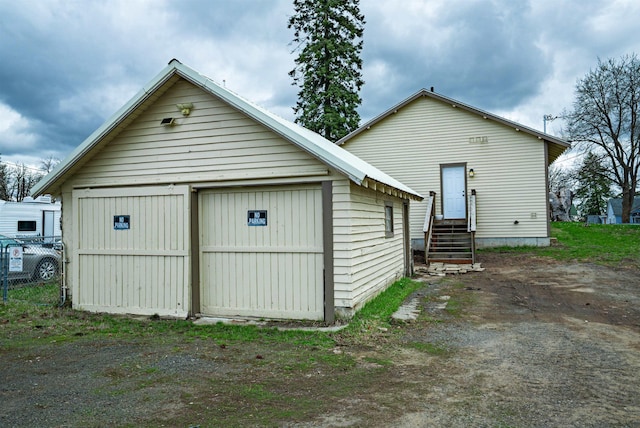 216 6th St, Cheney, WA 99004 - rear view of property featuring an outdoor structure and entry steps