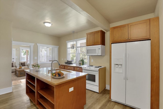 216 6th St, Cheney, WA 99004 - kitchen with white appliances, open shelves, a sink, light wood-style floors, and hanging light fixtures