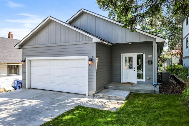 723 S Hatch St, Spokane, WA 99202 - ranch-style house featuring a garage, driveway, and central AC