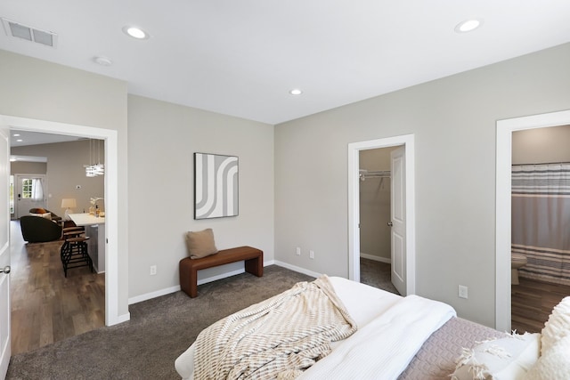 723 S Hatch St, Spokane, WA 99202 - carpeted bedroom with recessed lighting, baseboards, a spacious closet, and connected bathroom