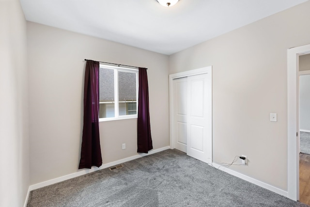 723 S Hatch St, Spokane, WA 99202 - unfurnished bedroom with carpet, baseboards, and a closet