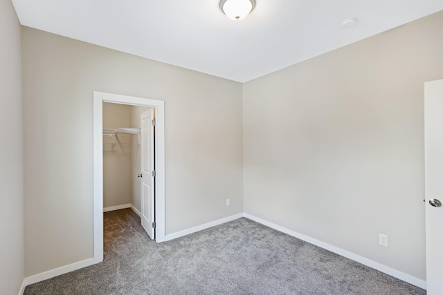 723 S Hatch St, Spokane, WA 99202 - unfurnished bedroom with carpet floors, a spacious closet, baseboards, and a closet
