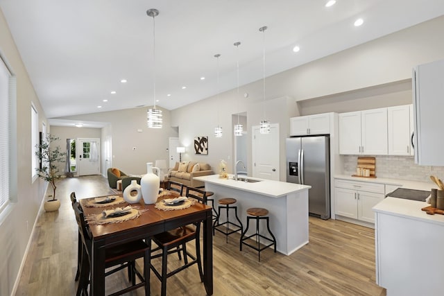 723 S Hatch St, Spokane, WA 99202 - dining space with light wood-style floors, recessed lighting, and high vaulted ceiling