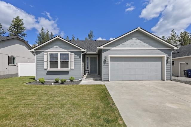 8604 W 8th Ave, Spokane, WA 99224 - ranch-style home featuring concrete driveway, a front yard, and an attached garage