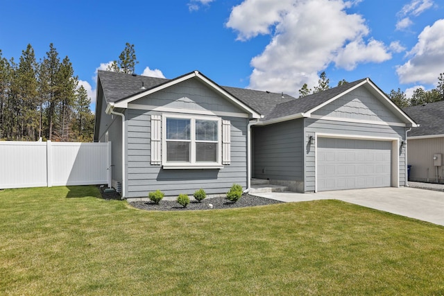 8604 W 8th Ave, Spokane, WA 99224 - view of front of property featuring a garage, concrete driveway, and roof with shingles