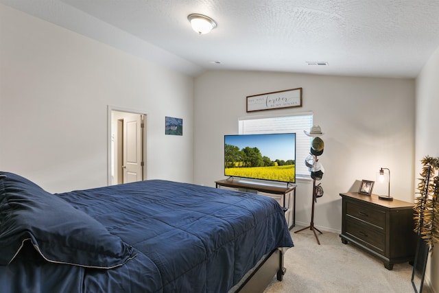 8604 W 8th Ave, Spokane, WA 99224 - bedroom with light colored carpet, vaulted ceiling, and baseboards