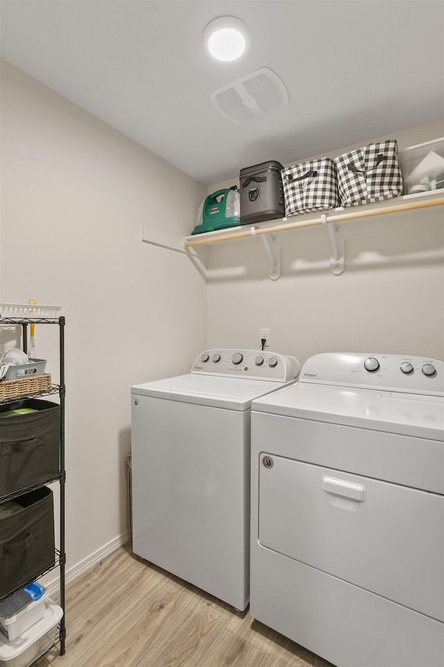 8604 W 8th Ave, Spokane, WA 99224 - washroom with separate washer and dryer, light wood finished floors, and baseboards