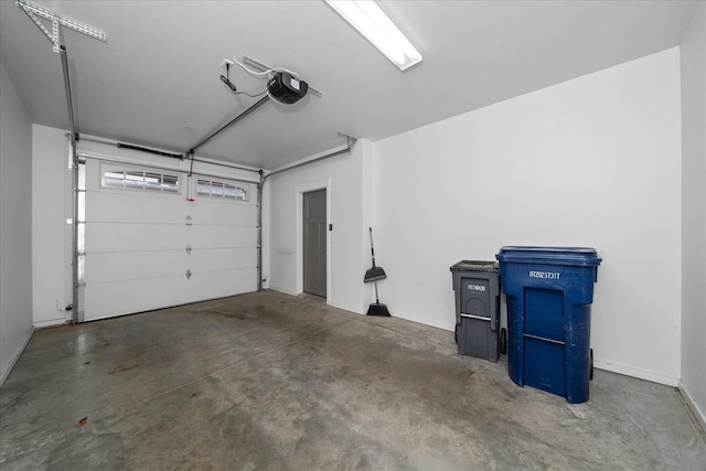 24481 E Pinnacle Ct Unit D, Liberty Lake, WA 99019 - garage featuring a garage door opener and baseboards