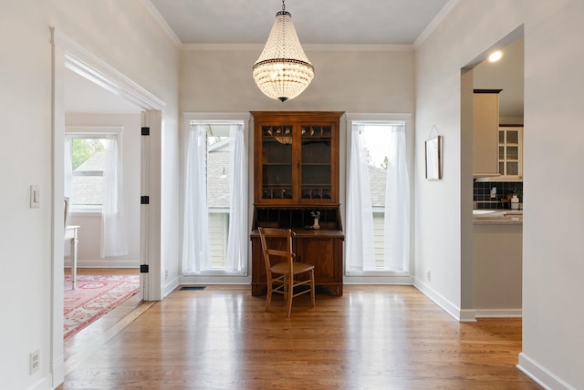 8904 E Boardwalk Ln, Spokane, WA 99212 - foyer with wood finished floors, a chandelier, and crown molding
