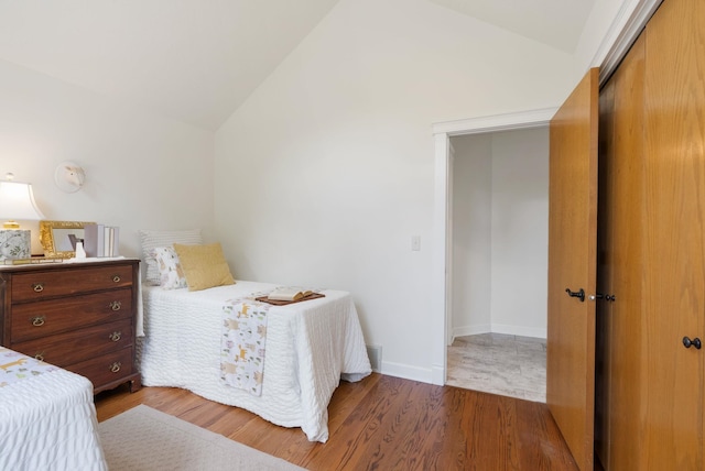 8904 E Boardwalk Ln, Spokane, WA 99212 - bedroom with wood finished floors, a closet, and high vaulted ceiling