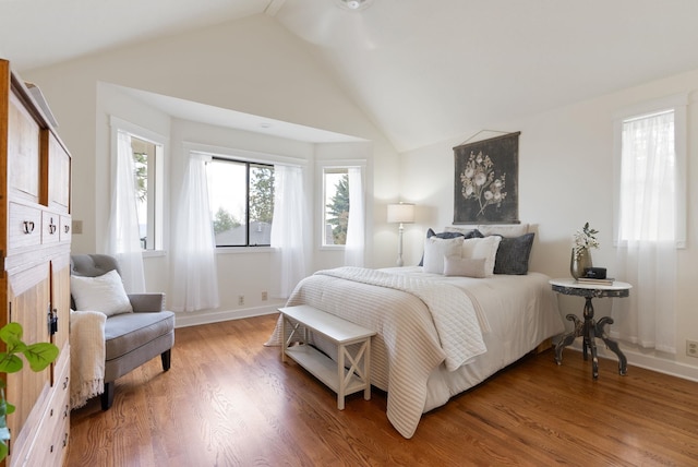 8904 E Boardwalk Ln, Spokane, WA 99212 - bedroom with vaulted ceiling and wood finished floors