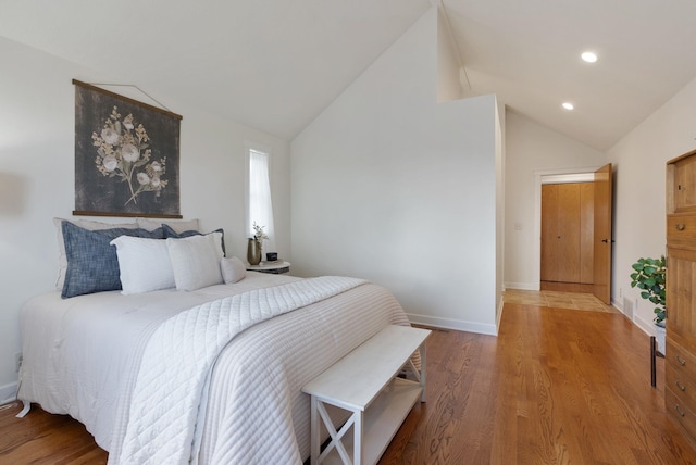 8904 E Boardwalk Ln, Spokane, WA 99212 - bedroom with vaulted ceiling, wood finished floors, and recessed lighting
