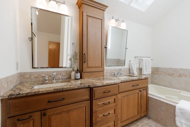 8904 E Boardwalk Ln, Spokane, WA 99212 - bathroom featuring double vanity, a garden tub, and tile patterned flooring
