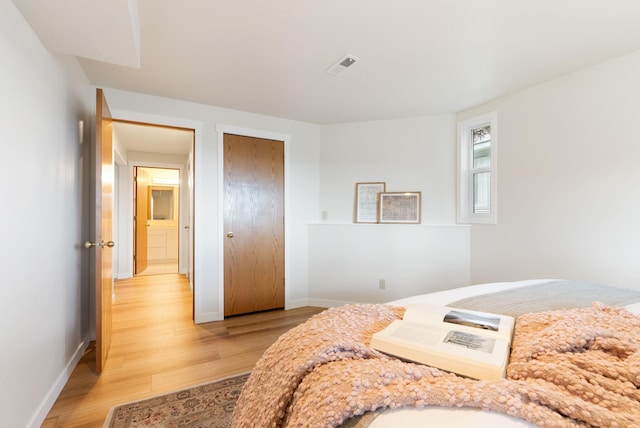 8904 E Boardwalk Ln, Spokane, WA 99212 - bedroom with light wood-type flooring and baseboards