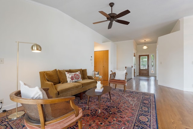 8904 E Boardwalk Ln, Spokane, WA 99212 - living room featuring vaulted ceiling, wood finished floors, ceiling fan, and ornamental molding