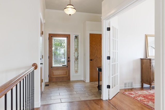 8904 E Boardwalk Ln, Spokane, WA 99212 - foyer entrance featuring wood finished floors and crown molding