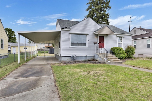 1419 E Glass Ave, Spokane, WA 99207 - view of front of property featuring an attached carport, driveway, and a shingled roof