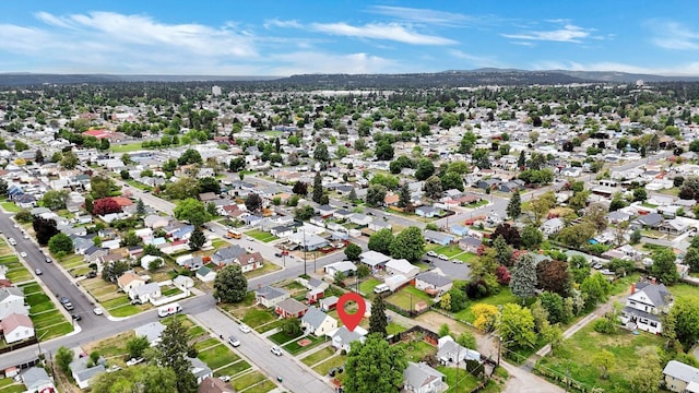 1419 E Glass Ave, Spokane, WA 99207 - aerial view of property's location with a mountain backdrop and nearby suburban area