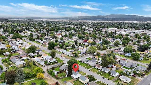 1419 E Glass Ave, Spokane, WA 99207 - aerial view of property and surrounding area with mountains and nearby suburban area