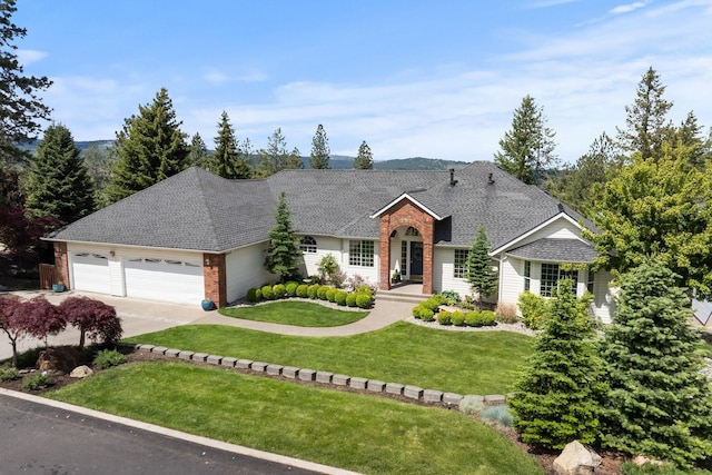14716 E 48th Ln, Veradale, WA 99037 - view of front of home with a garage, a front yard, brick siding, concrete driveway, and a shingled roof