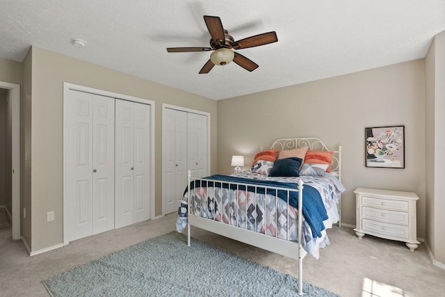 14716 E 48th Ln, Veradale, WA 99037 - bedroom featuring two closets, carpet floors, ceiling fan, and baseboards