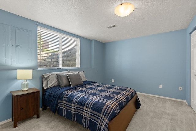 14716 E 48th Ln, Veradale, WA 99037 - bedroom with light colored carpet, a textured ceiling, and baseboards