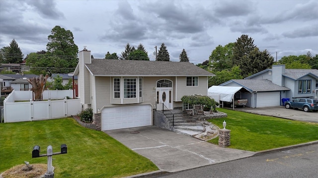 11920 E Railroad Ave, Spokane, WA 99206 - raised ranch with a gate, a chimney, concrete driveway, a garage, and roof with shingles
