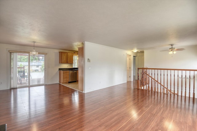 11920 E Railroad Ave, Spokane, WA 99206 - unfurnished living room with wood finished floors, ceiling fan, and baseboards