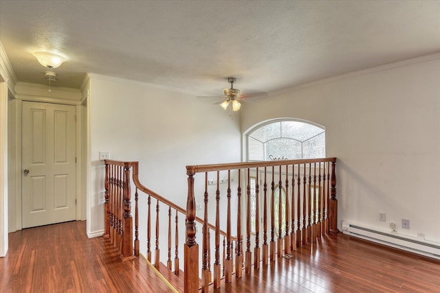 11920 E Railroad Ave, Spokane, WA 99206 - corridor with an upstairs landing, wood finished floors, a baseboard radiator, and crown molding