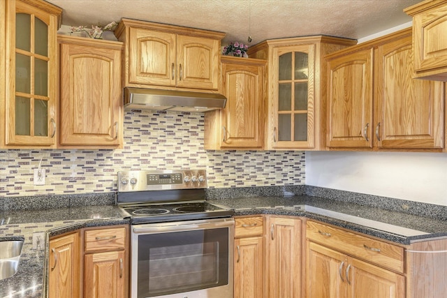 11920 E Railroad Ave, Spokane, WA 99206 - kitchen with electric range, ventilation hood, backsplash, glass insert cabinets, and a textured ceiling