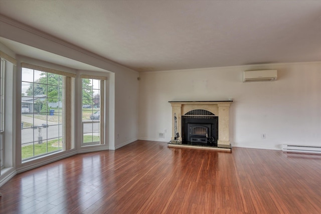 11920 E Railroad Ave, Spokane, WA 99206 - unfurnished living room featuring a wall mounted AC, a baseboard heating unit, wood finished floors, baseboards, and crown molding