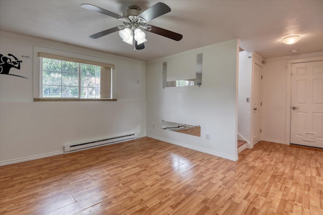 11920 E Railroad Ave, Spokane, WA 99206 - spare room with a baseboard radiator, wood finished floors, a ceiling fan, baseboards, and ornamental molding