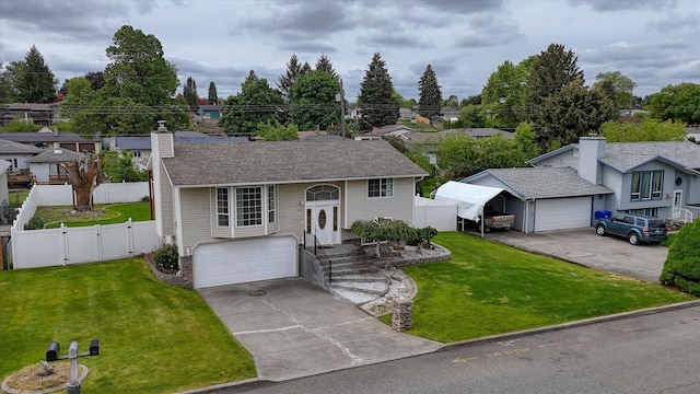 11920 E Railroad Ave, Spokane, WA 99206 - raised ranch with a gate, concrete driveway, an outdoor structure, a chimney, and an attached garage