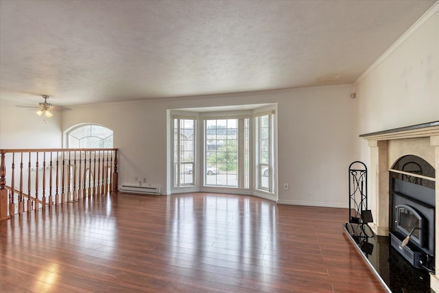11920 E Railroad Ave, Spokane, WA 99206 - living room with a baseboard heating unit, ceiling fan, dark wood-style floors, ornamental molding, and a textured ceiling